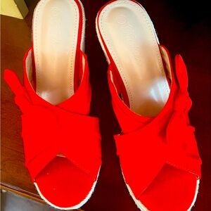 Brand new red slip on wedges never worn. Size 7 1/2